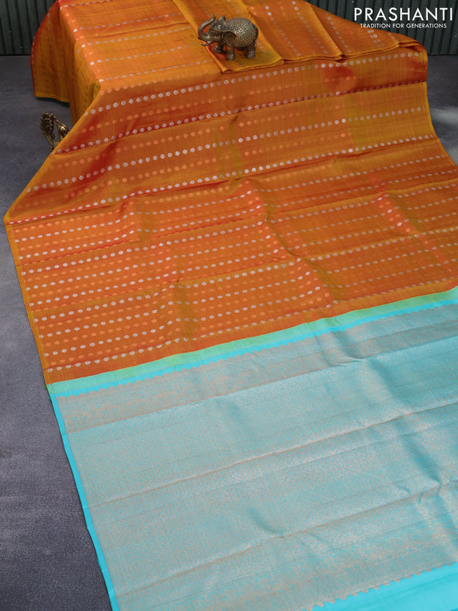 Pure kanchipuram silk saree dual shade of dark mustard and teal blue with allover silver & zari woven 1000 buttas in borderless style