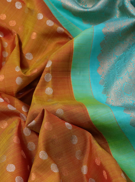 Pure kanchipuram silk saree dual shade of dark mustard and teal blue with allover silver & zari woven 1000 buttas in borderless style