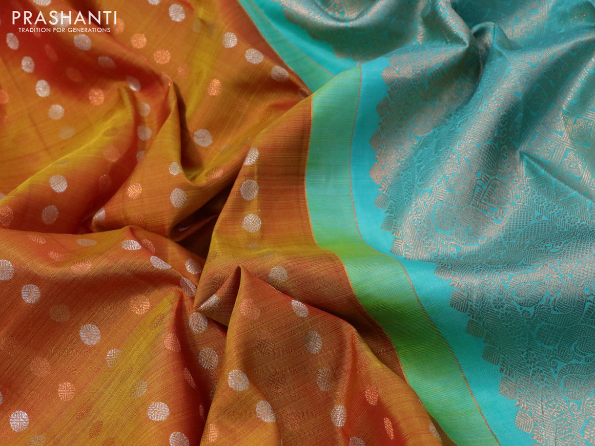 Pure kanchipuram silk saree dual shade of dark mustard and teal blue with allover silver & zari woven 1000 buttas in borderless style