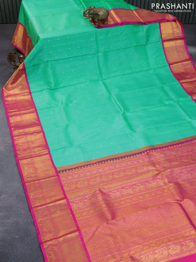 Pure kanchipuram silk saree dual shade of teal green and pink with allover zari checks & buttas and zari woven border