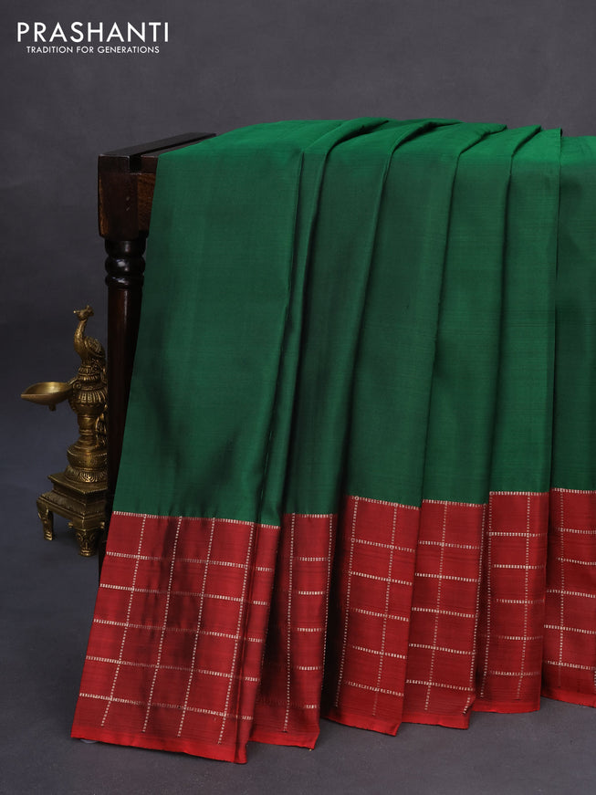 Pure kanchipuram silk saree green and maroon with plain body and zari checked border