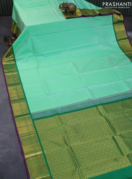 Pure kanchipuram silk saree pastel green and purple with plain body and zari woven korvai border