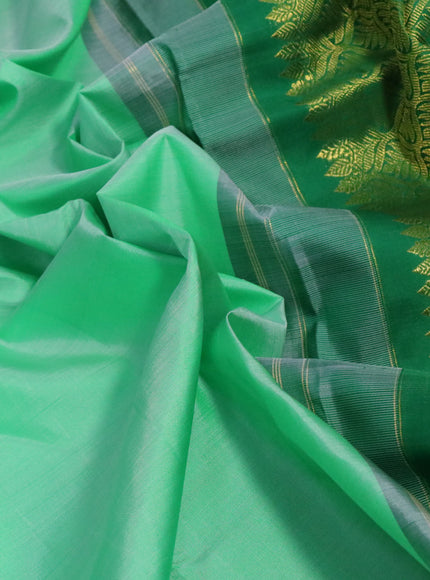 Pure kanchipuram silk saree pastel green and purple with plain body and zari woven korvai border