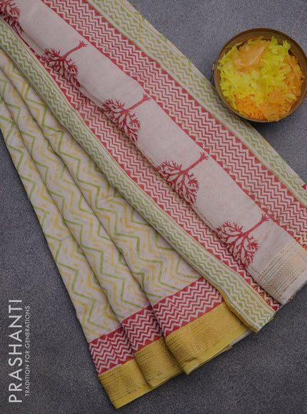 Chanderi bagru saree off white and yellow with allover zig zag prints and zari woven maheswari border