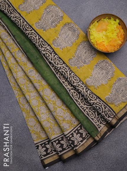 Chanderi bagru saree yellow and black with allover prints and small zari woven border