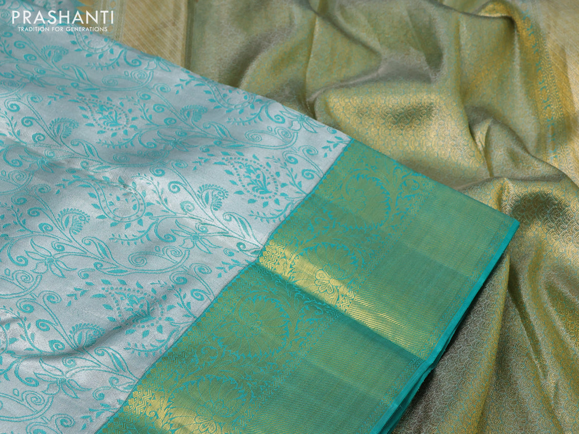 Pure kanchipuram tissue silk saree grey and teal green shade with allover silver zari woven brocade weaves and rich zari woven korvai border