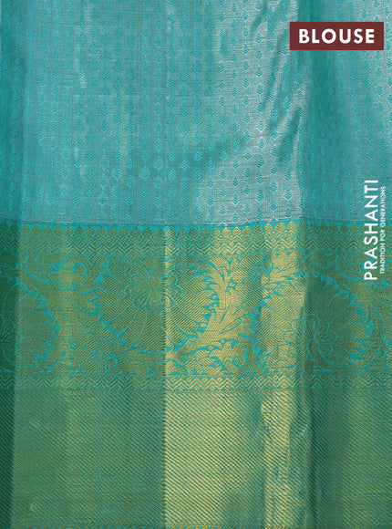 Pure kanchipuram tissue silk saree grey and teal green shade with allover silver zari woven brocade weaves and rich zari woven korvai border