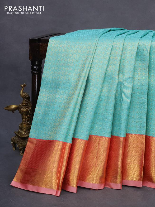 Pure kanchipuram silk saree teal blue and peach red with allover zari woven brocade weaves and zari woven border