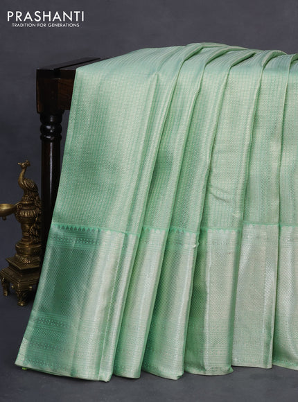 Pure kanchipuram tissue silk saree pastel green with allover silver zari woven brocade weaves and long silver zari woven border