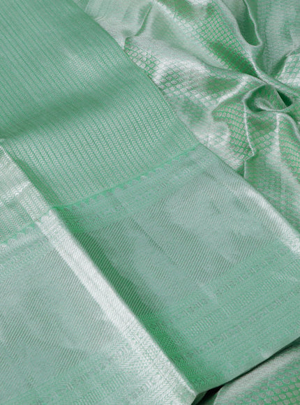 Pure kanchipuram tissue silk saree pastel green with allover silver zari woven brocade weaves and long silver zari woven border