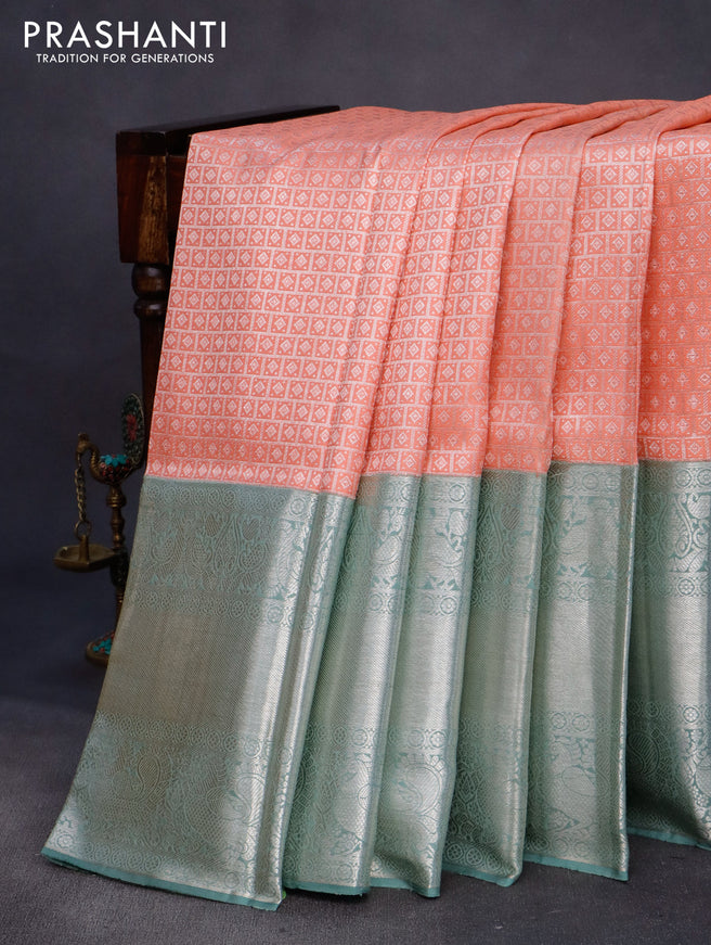 Pure kanchipuram silk saree peach shade and pastel green with allover silver zari woven brocade weaves and long silver zari woven border