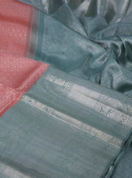 Pure kanchipuram silk saree peach shade and pastel green with allover silver zari woven brocade weaves and long silver zari woven border