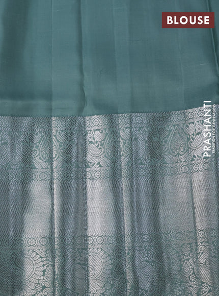 Pure kanchipuram silk saree peach shade and pastel green with allover silver zari woven brocade weaves and long silver zari woven border