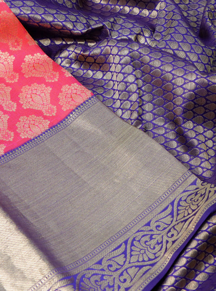 Pure kanchipuram silk saree dual shade of pinkish orange and dark blue with allover zari woven brocade weaves and long zari woven border