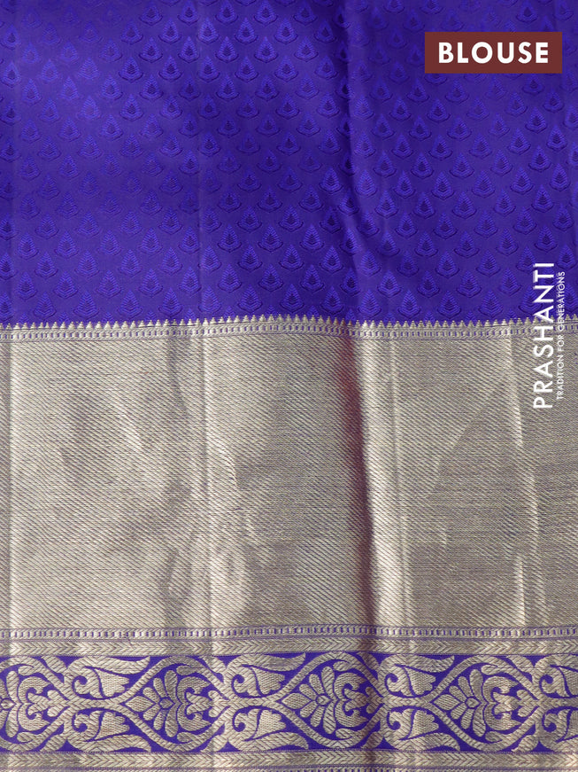 Pure kanchipuram silk saree dual shade of pinkish orange and dark blue with allover zari woven brocade weaves and long zari woven border