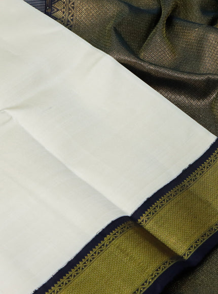 Pure kanchipuram silk saree cream and black with plain body and zari wove korvai border