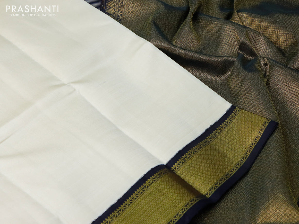 Pure kanchipuram silk saree cream and black with plain body and zari wove korvai border