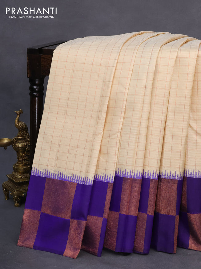 Pure kanchipuram silk saree cream and blue with allover copper zari checked pattern and temple design copper zari woven border