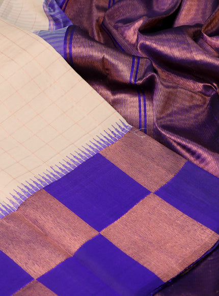 Pure kanchipuram silk saree cream and blue with allover copper zari checked pattern and temple design copper zari woven border