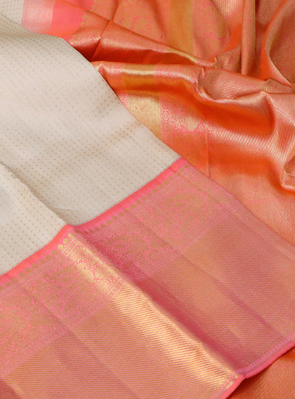 Pure kanchipuram silk saree cream and dual shade of peach orange with allover zari weaves and long zari woven border