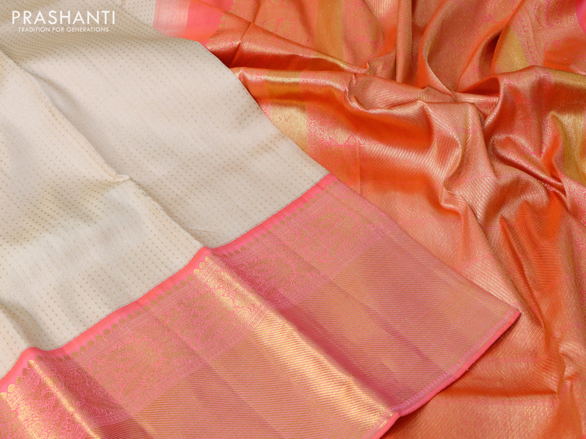 Pure kanchipuram silk saree cream and dual shade of peach orange with allover zari weaves and long zari woven border