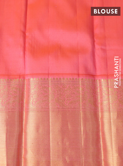 Pure kanchipuram silk saree cream and dual shade of peach orange with allover zari weaves and long zari woven border