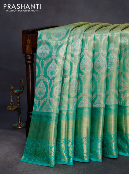 Pure kanchipuram tissue silk saree dual shade of teal blue shade with allover zari woven brocade weaves and long rich zari woven border