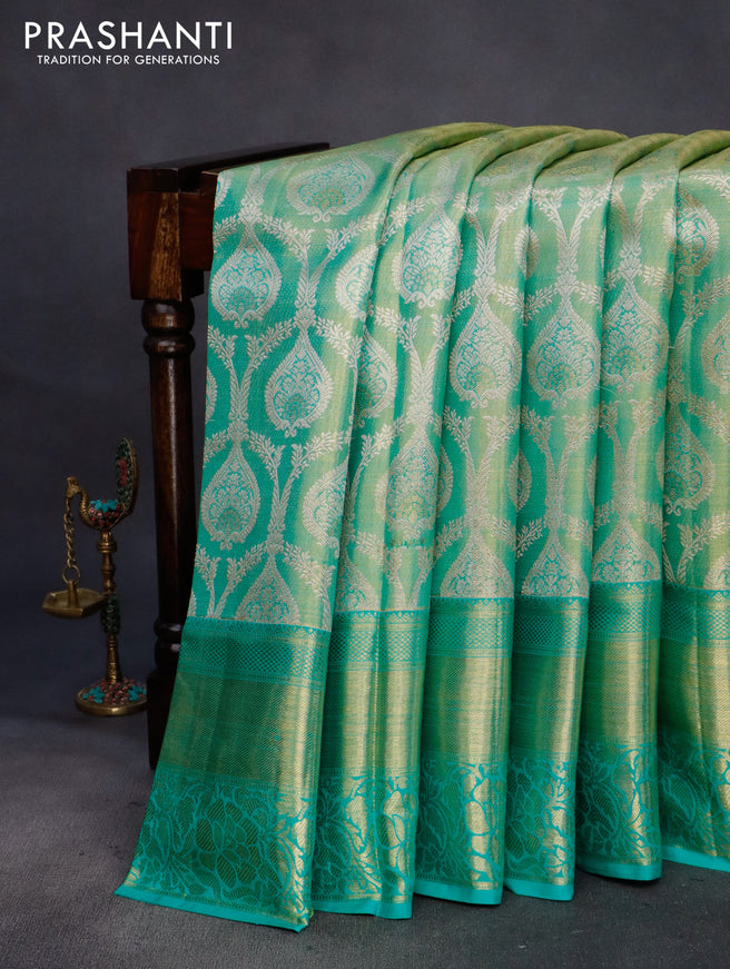 Pure kanchipuram tissue silk saree dual shade of teal blue shade with allover zari woven brocade weaves and long rich zari woven border