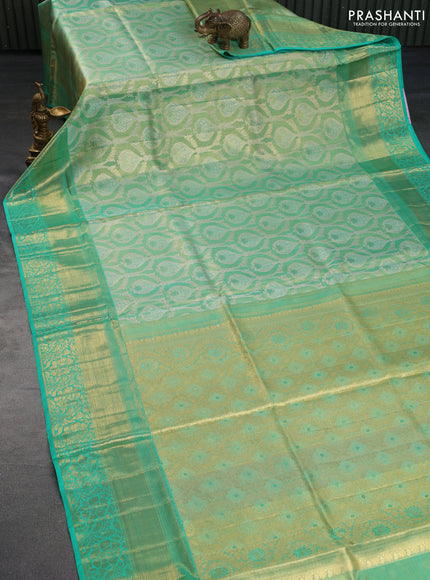 Pure kanchipuram tissue silk saree dual shade of teal blue shade with allover zari woven brocade weaves and long rich zari woven border