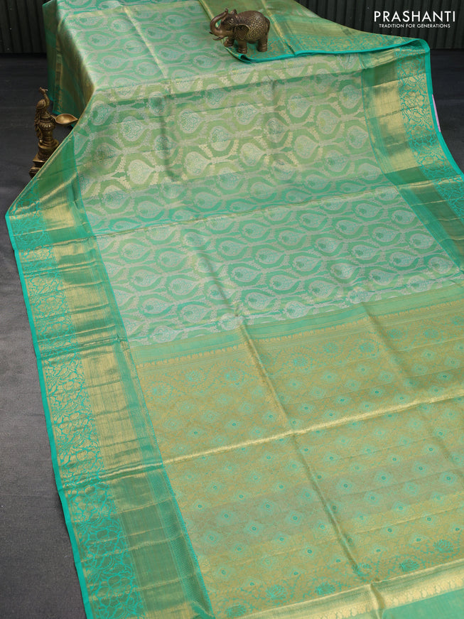 Pure kanchipuram tissue silk saree dual shade of teal blue shade with allover zari woven brocade weaves and long rich zari woven border