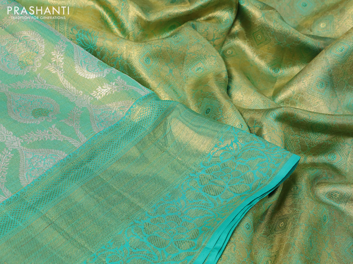 Pure kanchipuram tissue silk saree dual shade of teal blue shade with allover zari woven brocade weaves and long rich zari woven border