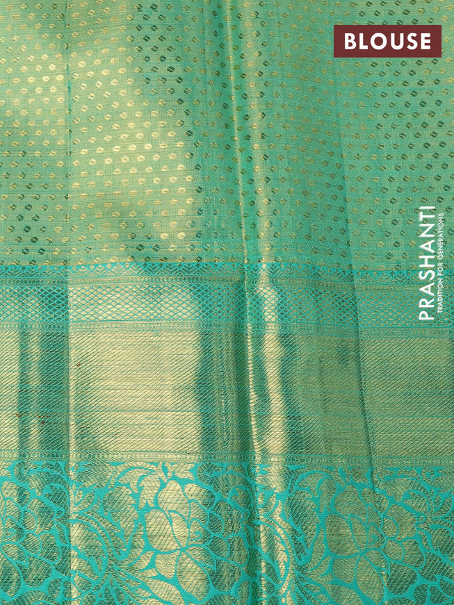 Pure kanchipuram tissue silk saree dual shade of teal blue shade with allover zari woven brocade weaves and long rich zari woven border