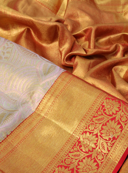 Pure kanchipuram tissue silk saree golddish pink and red with allover zari woven brocade weaves and long rich zari woven floral border