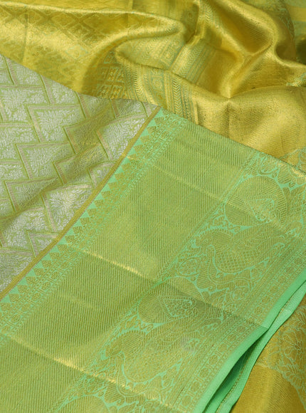 Pure kanchipuram silk saree lime green and pista green with allover zari woven brocade weaves and long rich zari woven annam border