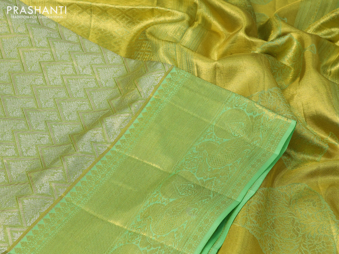 Pure kanchipuram silk saree lime green and pista green with allover zari woven brocade weaves and long rich zari woven annam border