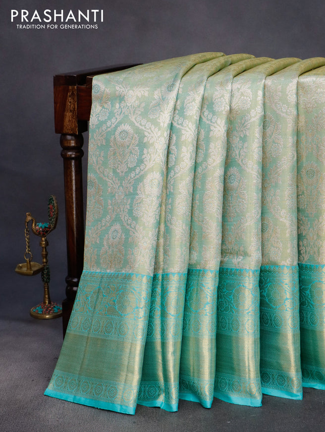 Pure kanchipuram tissue silk saree gold and teal blue with allover zari woven brocade weaves and long rich zari woven border