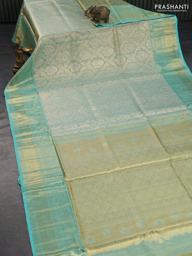 Pure kanchipuram tissue silk saree gold and teal blue with allover zari woven brocade weaves and long rich zari woven border