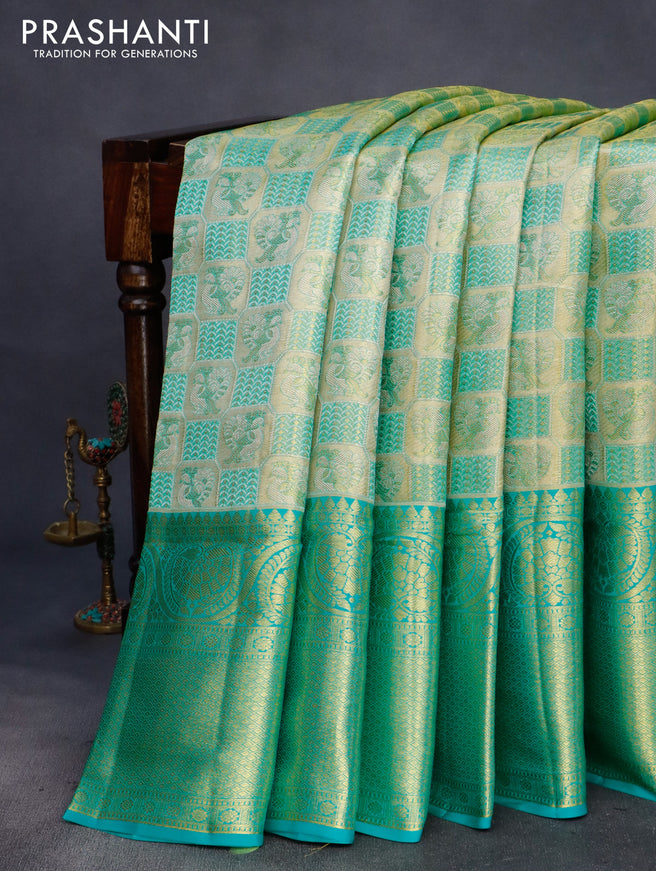 Pure kanchipuram tissue silk saree gold and teal blue with allover annam zari woven brocade weaves and long rich zari woven border