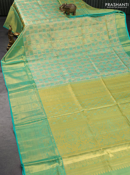 Pure kanchipuram tissue silk saree gold and teal blue with allover annam zari woven brocade weaves and long rich zari woven border