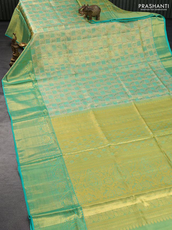 Pure kanchipuram tissue silk saree gold and teal blue with allover annam zari woven brocade weaves and long rich zari woven border