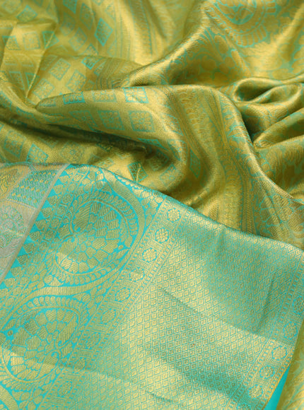 Pure kanchipuram tissue silk saree gold and teal blue with allover annam zari woven brocade weaves and long rich zari woven border