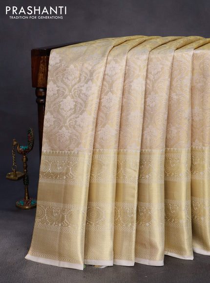 Pure kanchipuram tissue silk saree cream with allover zari woven brocade weaves and long rich zari woven border