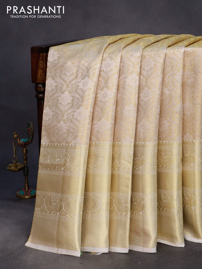 Pure kanchipuram tissue silk saree cream with allover zari woven brocade weaves and long rich zari woven border