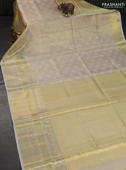 Pure kanchipuram tissue silk saree cream with allover zari woven brocade weaves and long rich zari woven border