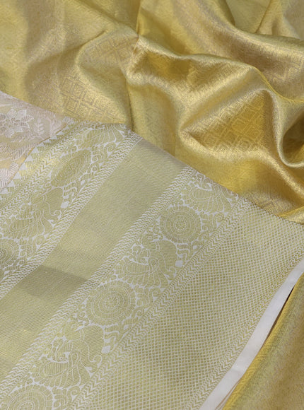 Pure kanchipuram tissue silk saree cream with allover zari woven brocade weaves and long rich zari woven border