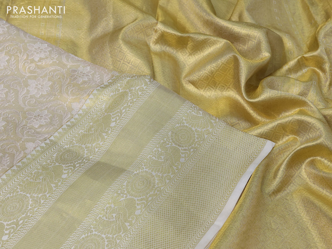 Pure kanchipuram tissue silk saree cream with allover zari woven brocade weaves and long rich zari woven border