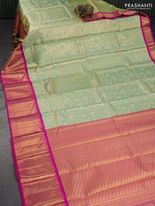 Pure kanchipuram silk saree dual shade of green and pink with allover zari woven floral brocade weaves and long zari woven korvai border