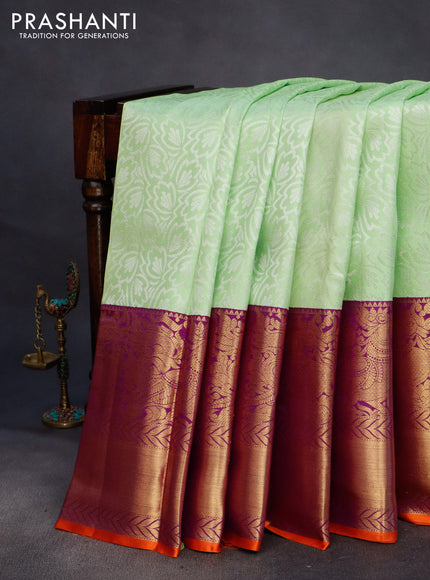 Pure kanchipuram silk saree pista green and violet with allover silver zari weaves and long annam zari woven korvai border