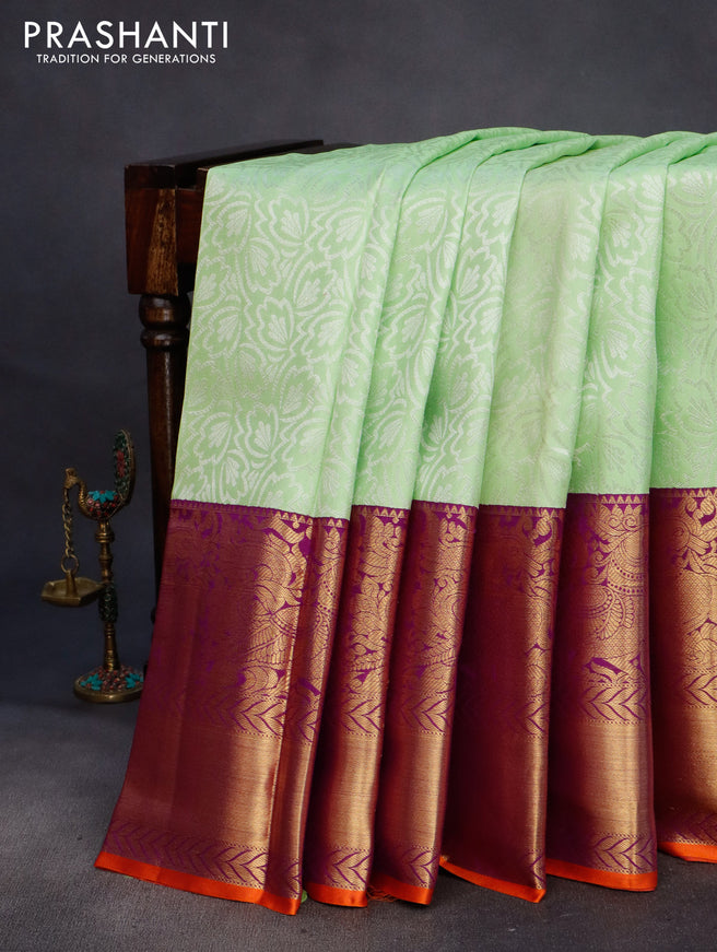 Pure kanchipuram silk saree pista green and violet with allover silver zari weaves and long annam zari woven korvai border