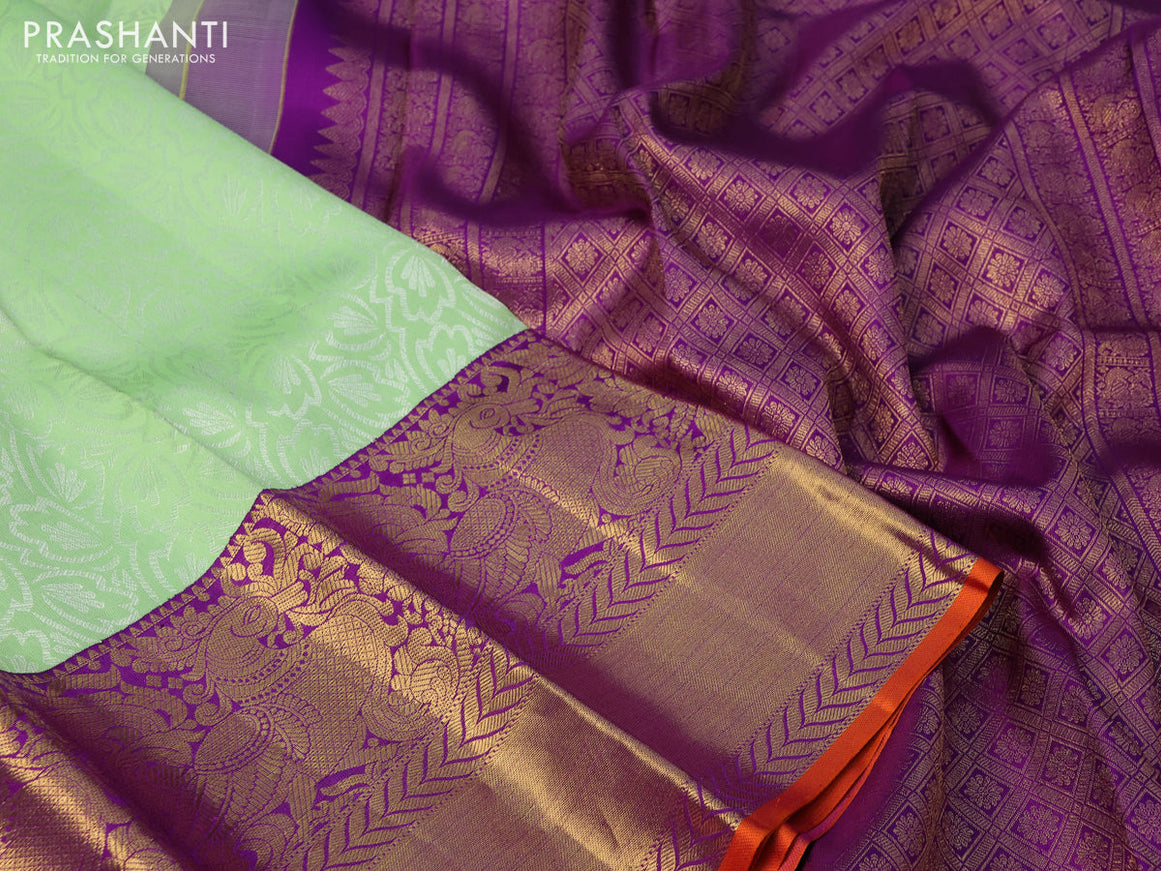 Pure kanchipuram silk saree pista green and violet with allover silver zari weaves and long annam zari woven korvai border